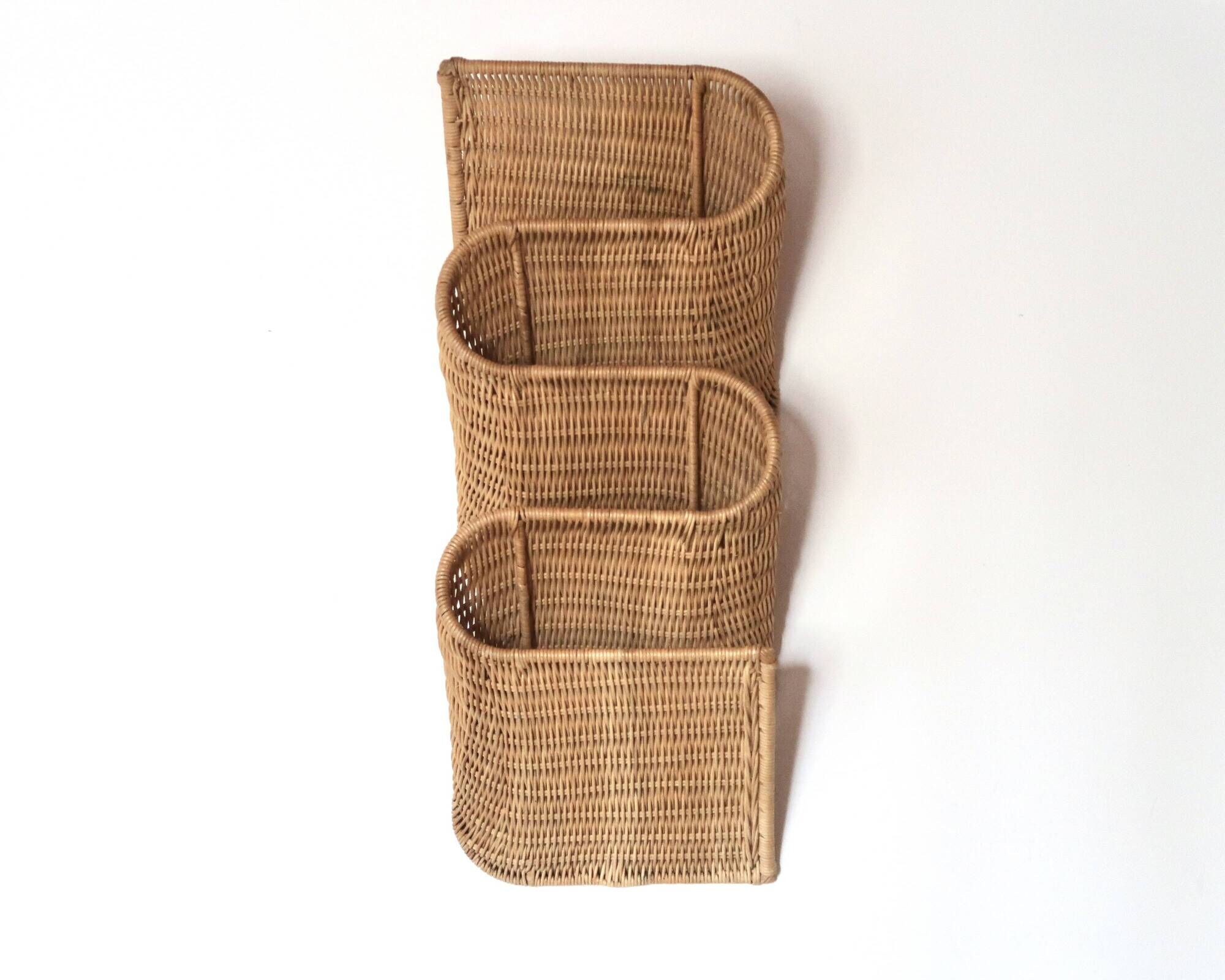 Wall-mounted magazine rack TIBY in rattan wicker by Karl Malmvall for Ikea from the 90s.