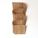 Wall-mounted magazine rack TIBY in rattan wicker by Karl Malmvall for Ikea from the 90s.