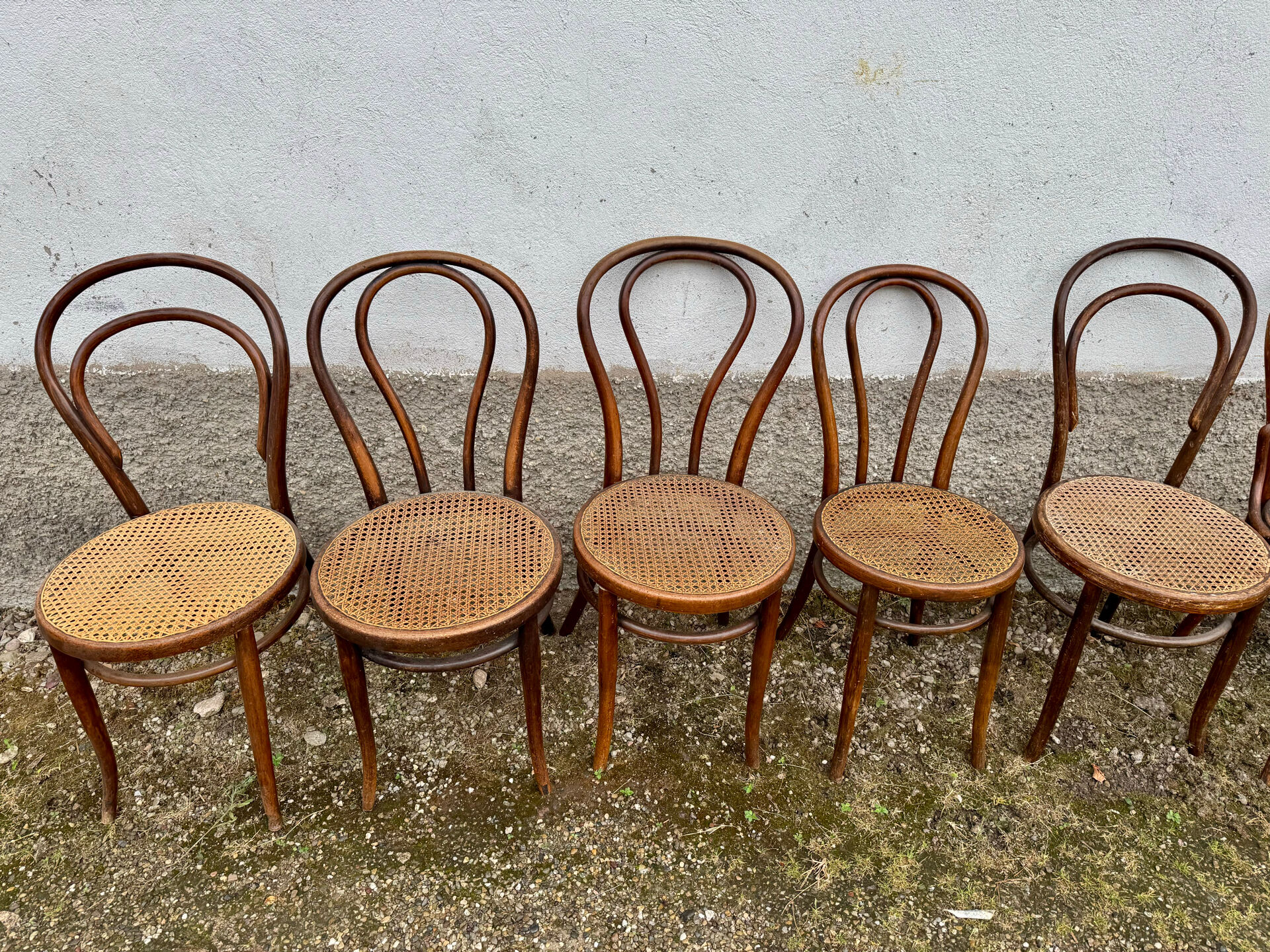 Set of 10 bentwood bistro chairs with cane seat.