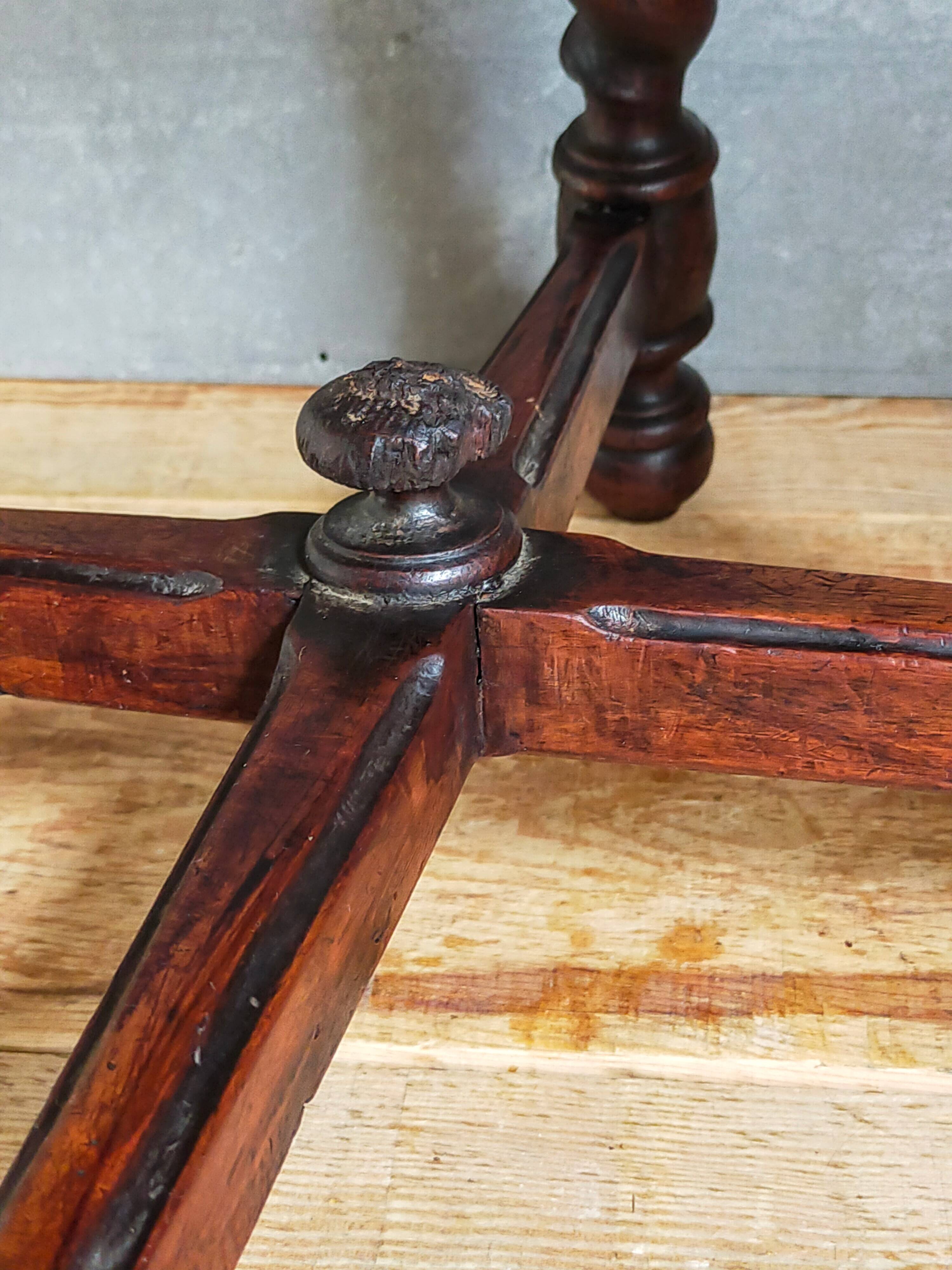 Antique stool in turned and carved solid wood