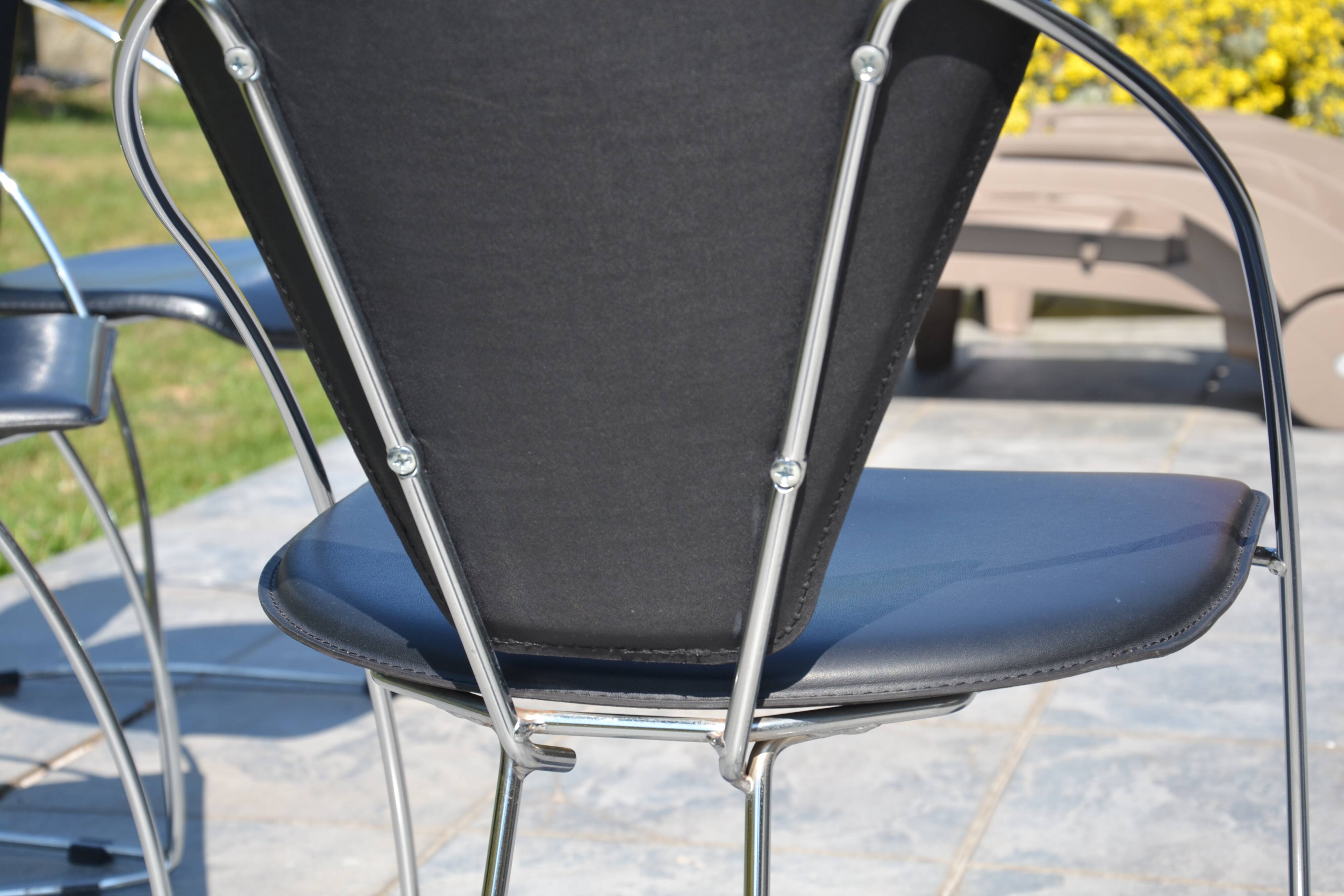 4 chrome and leather chairs designed by Italy