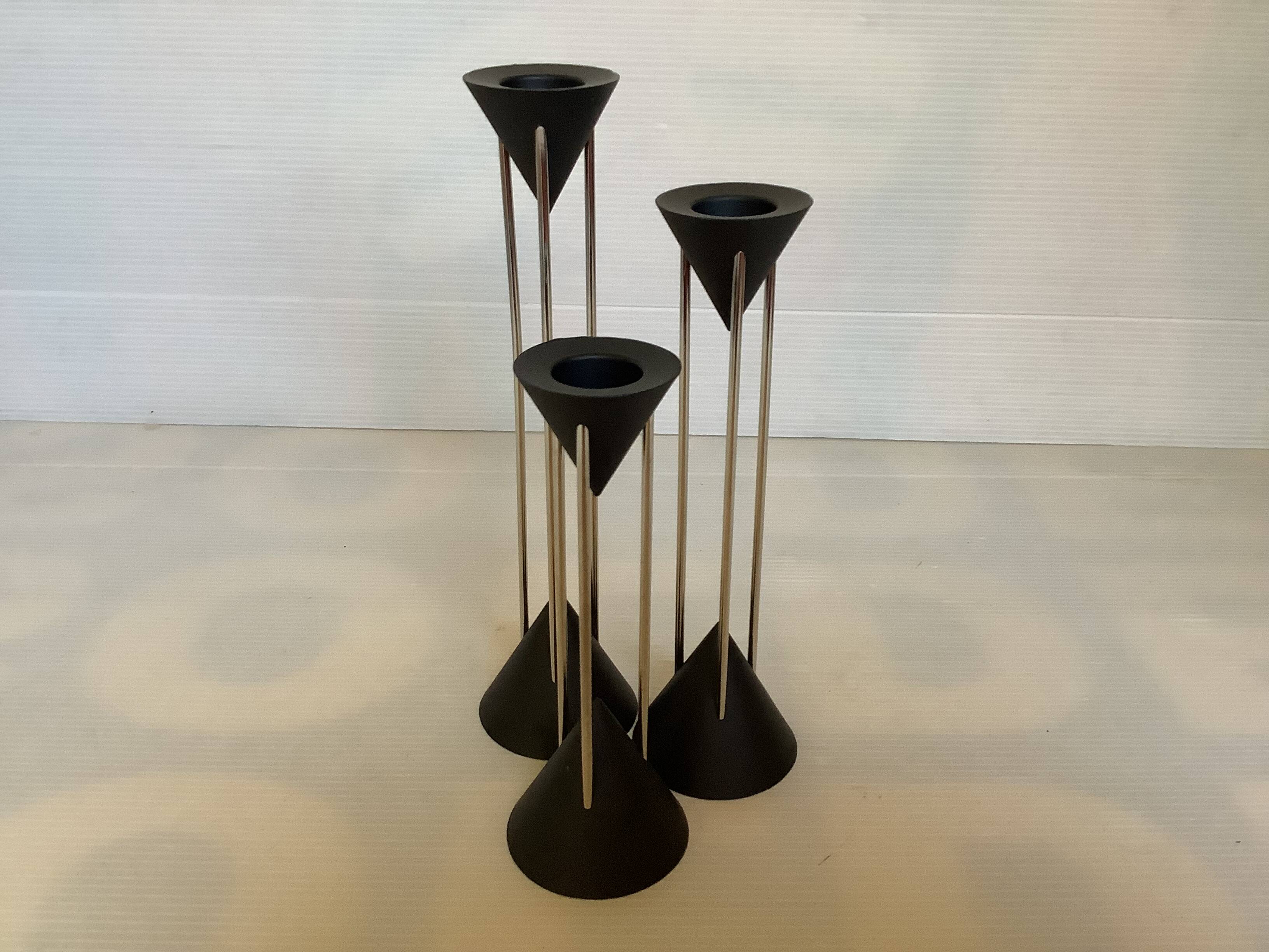 Vintage black candlestick trio