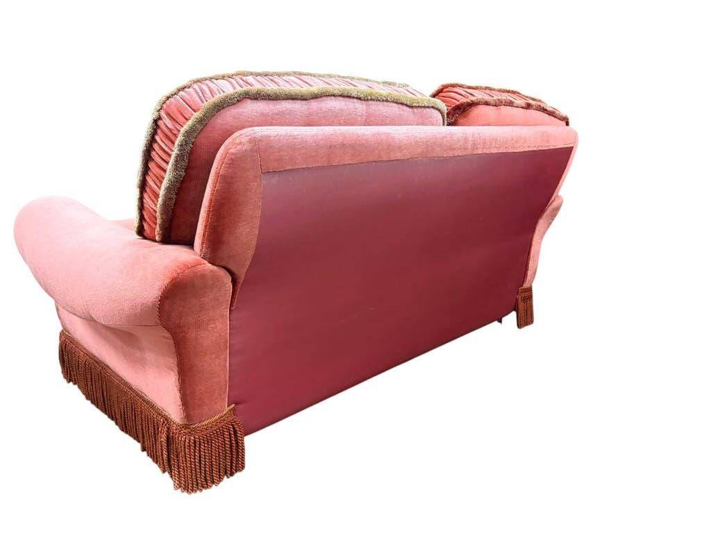 Vintage pink two-seater sofa with fringes