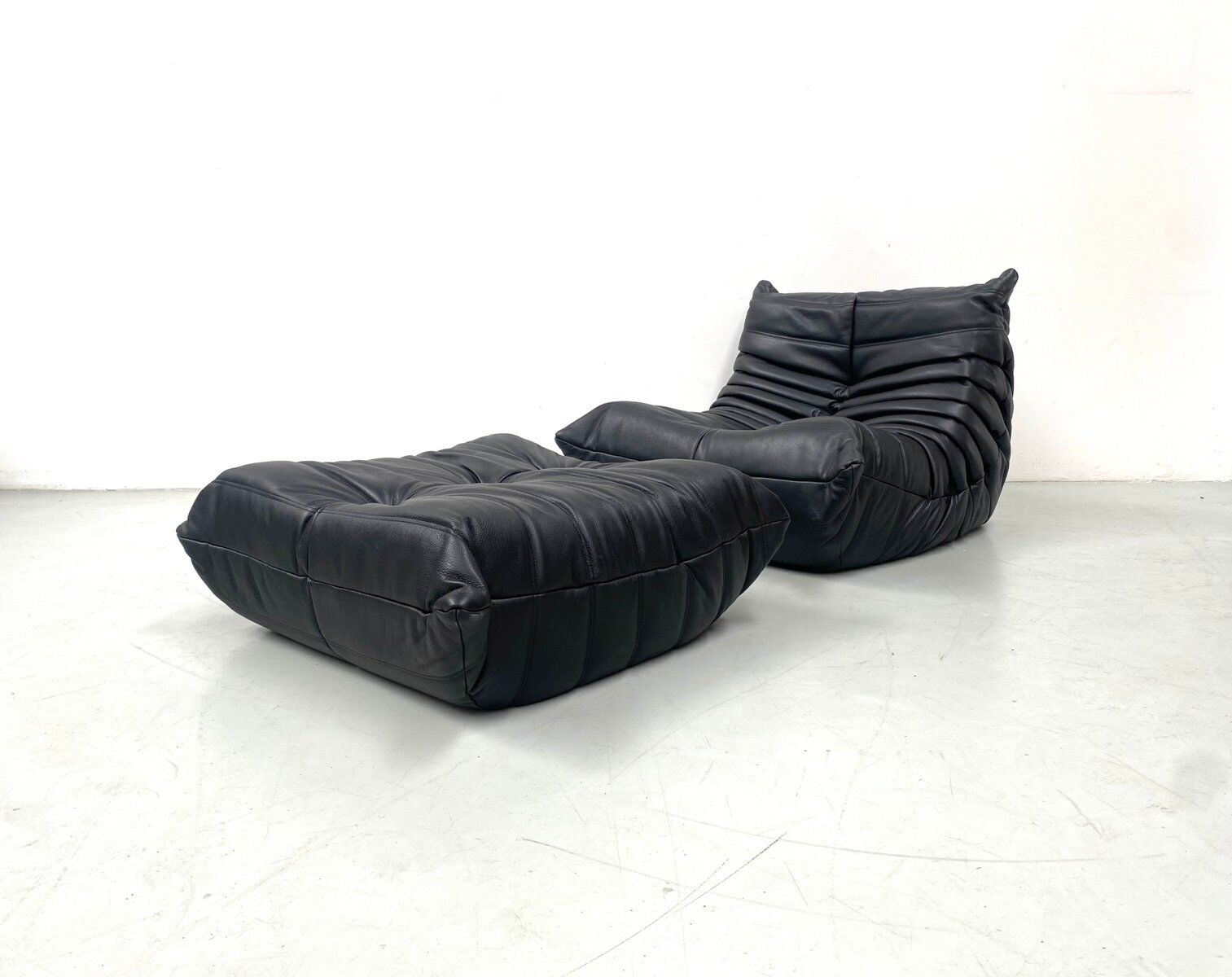 Togo chair and pouffe-black leather attributed to Ducaroy for Ligne Roset.