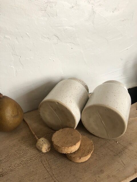 Duo of pots with white sandstone lids