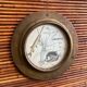 Rattan and wood bar with its decorative brass portholes