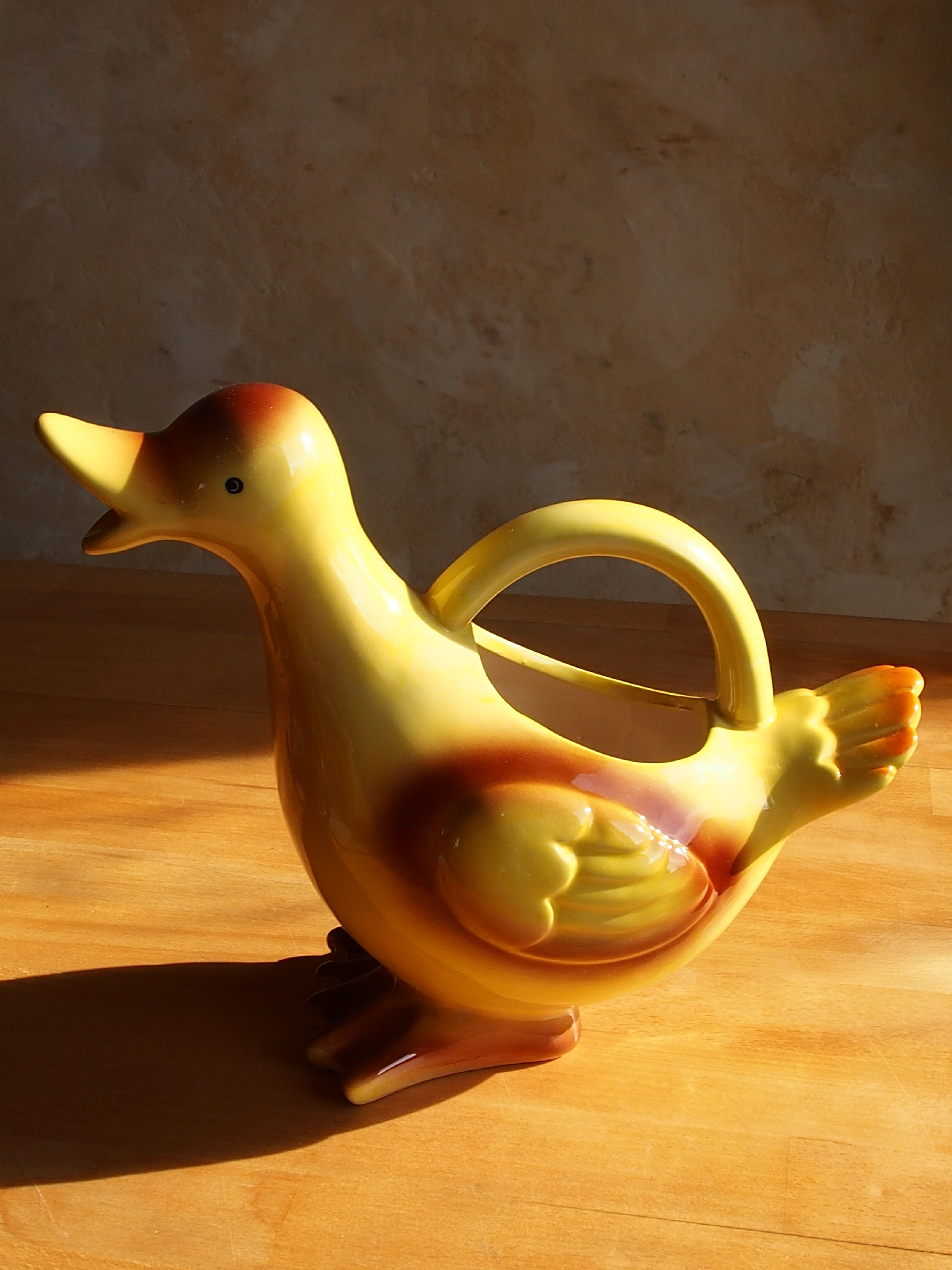 Ceramic watering can in white earthenware, yellow enamel and bird shape