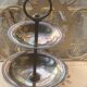 Double cup display in vintage silver metal