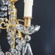 Paire d’appliques deux feux en bronze avec pampilles et guirlandes en cristal – Style Louis XV