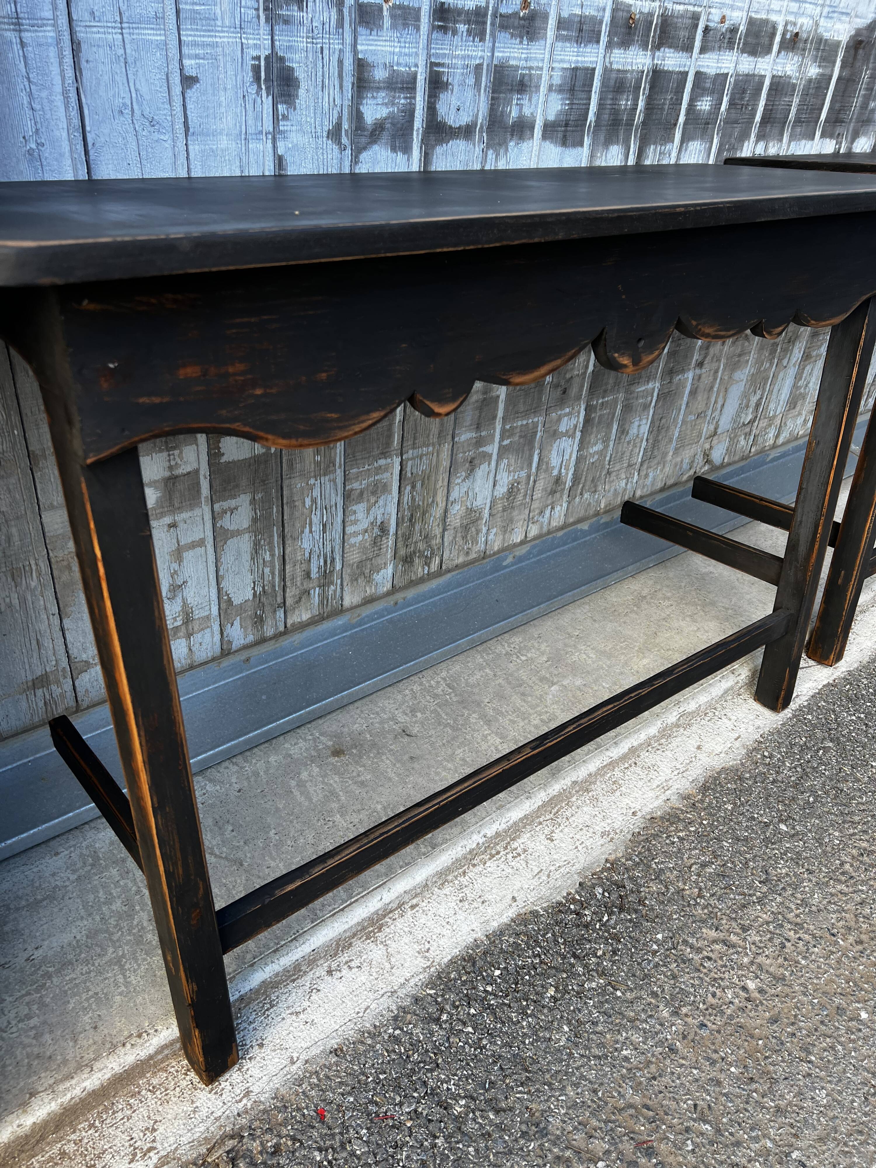 Pair of black patinated consoles