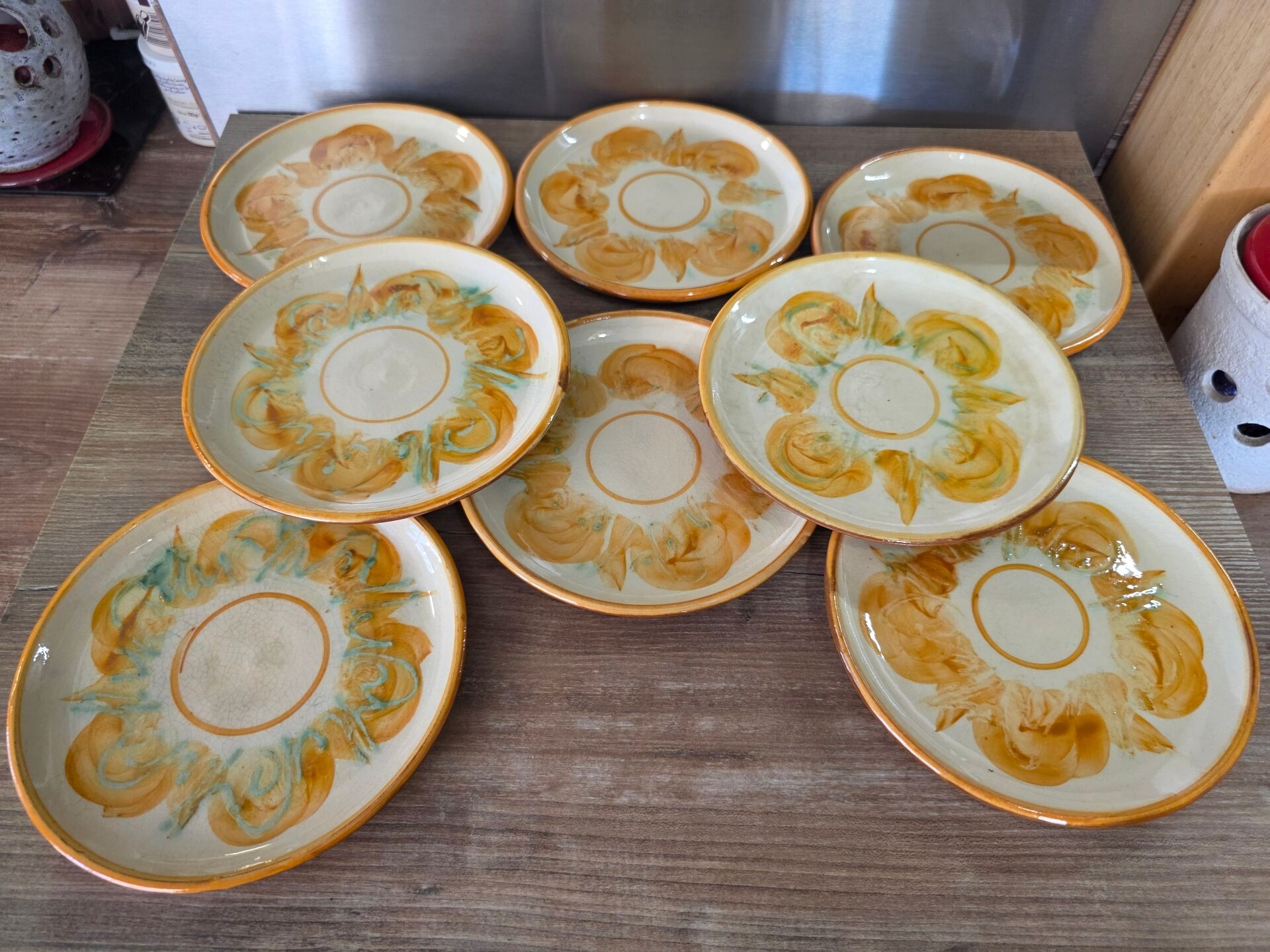 8 vintage dessert plates with a signed decoration.