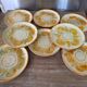 8 vintage dessert plates with a signed decoration.