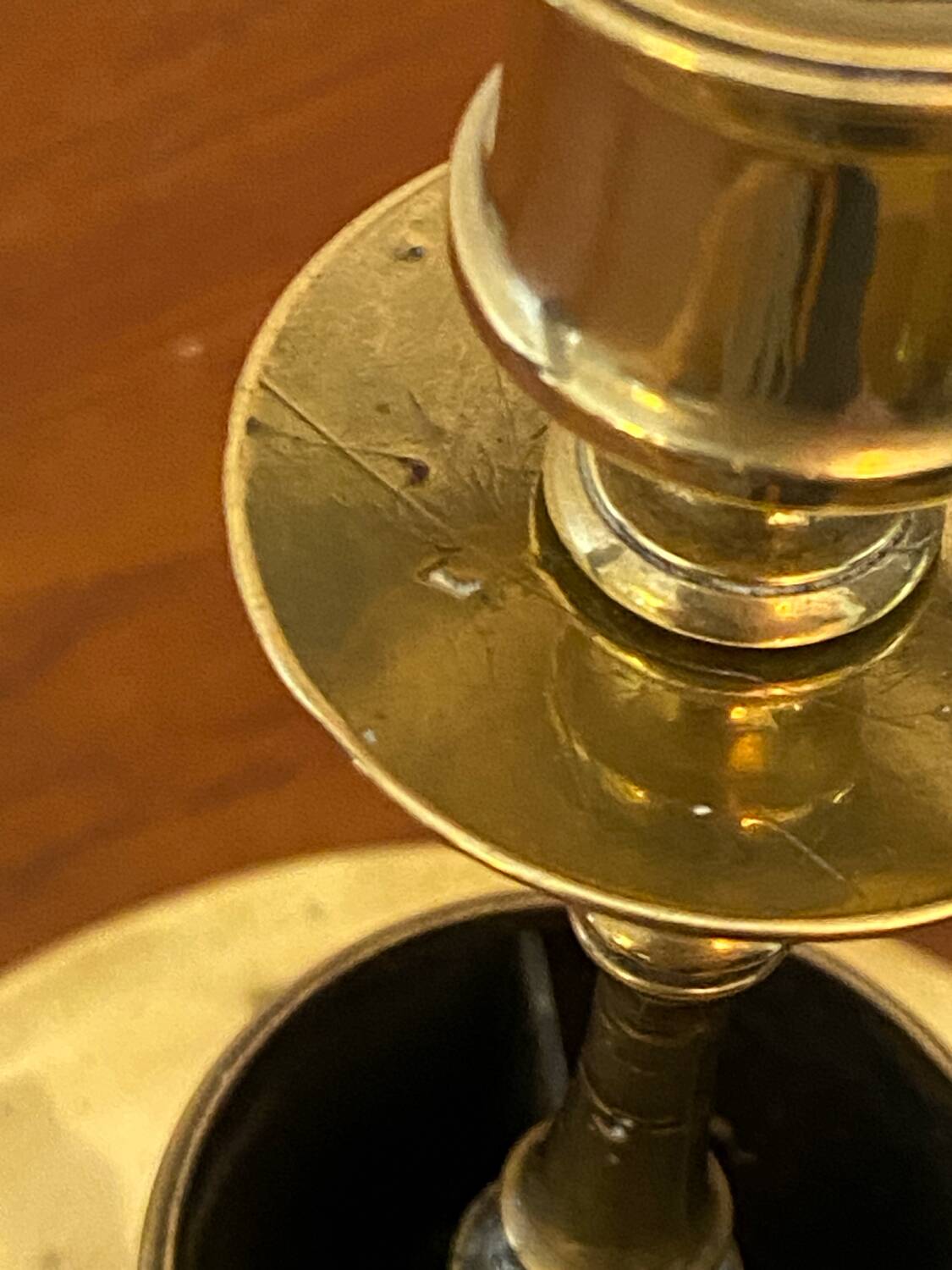 Compartmentalised brass candlestick
