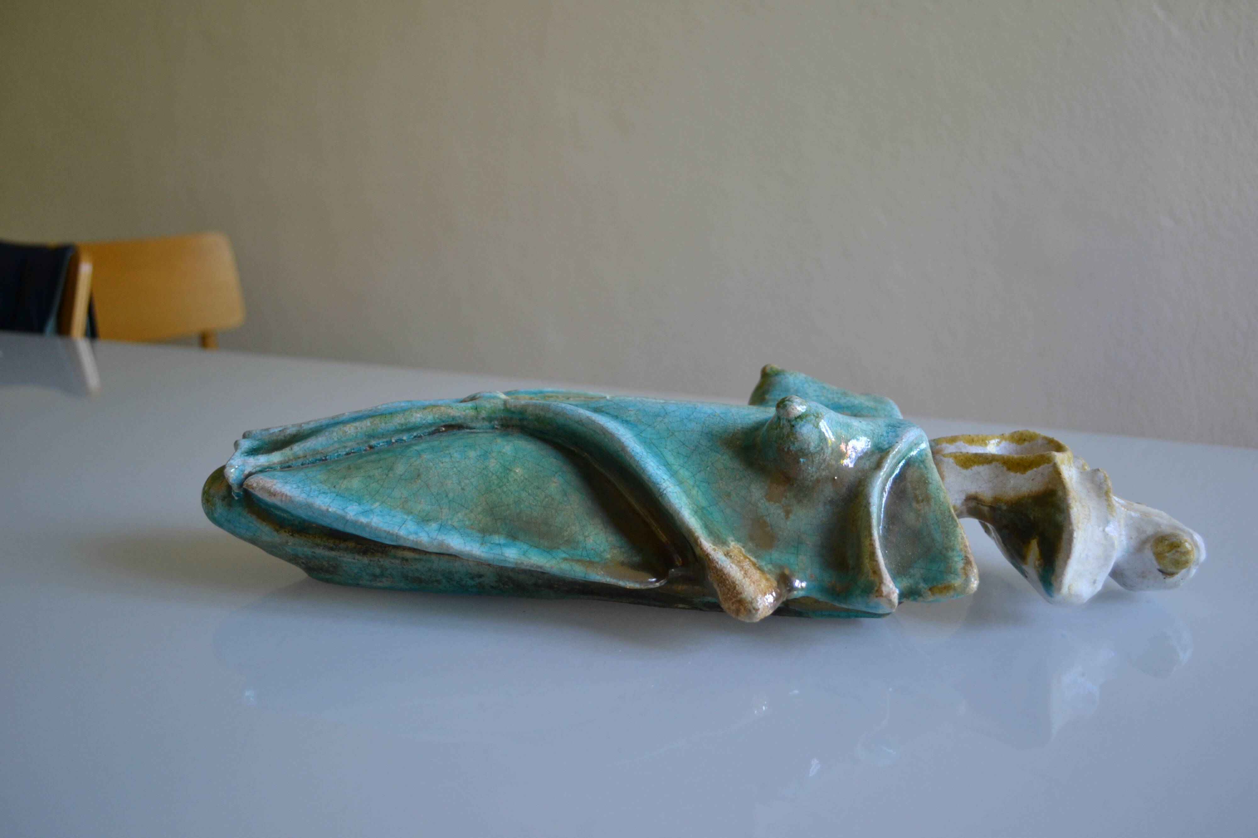 Surreal ceramic sculpture in relief signed to be identified.