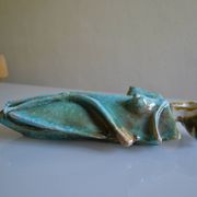 Surreal ceramic sculpture in relief signed to be identified.