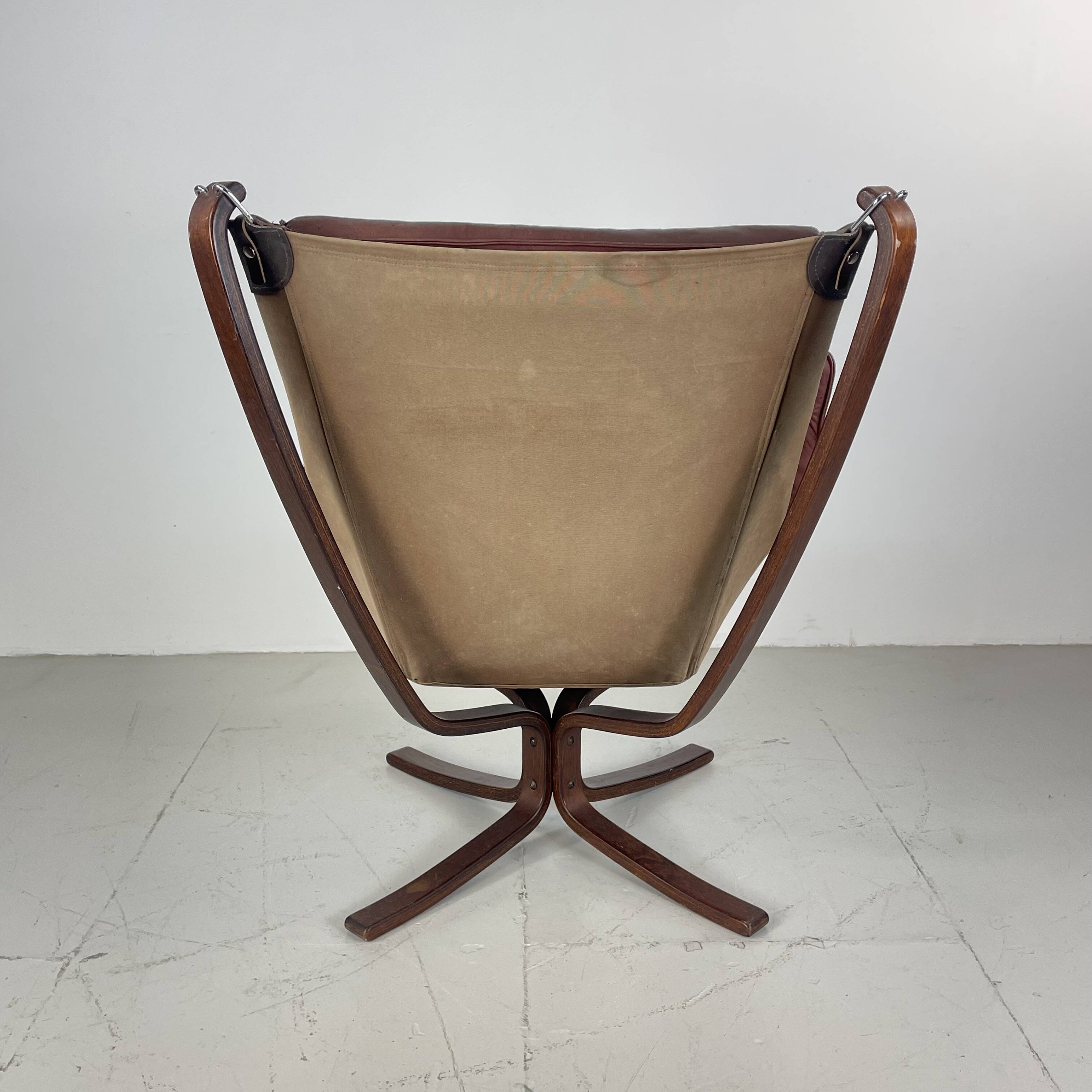 Vintage winged leather high backed Falcon chair designed by Sigurd Resell