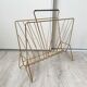 Vintage gold metal magazine rack