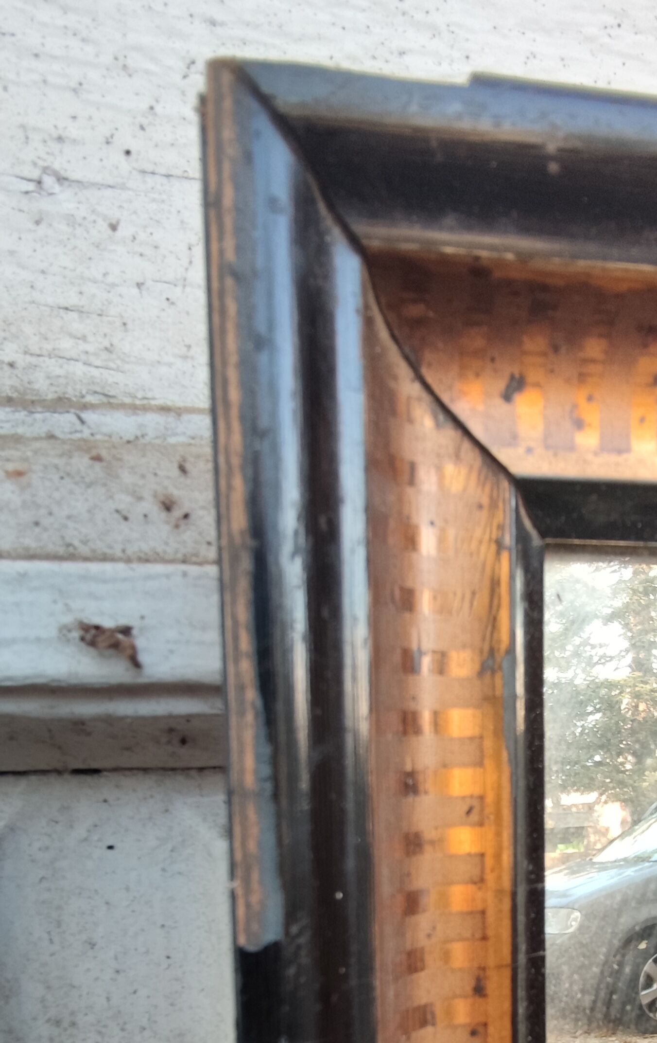 Antique mirror/black and gold frame