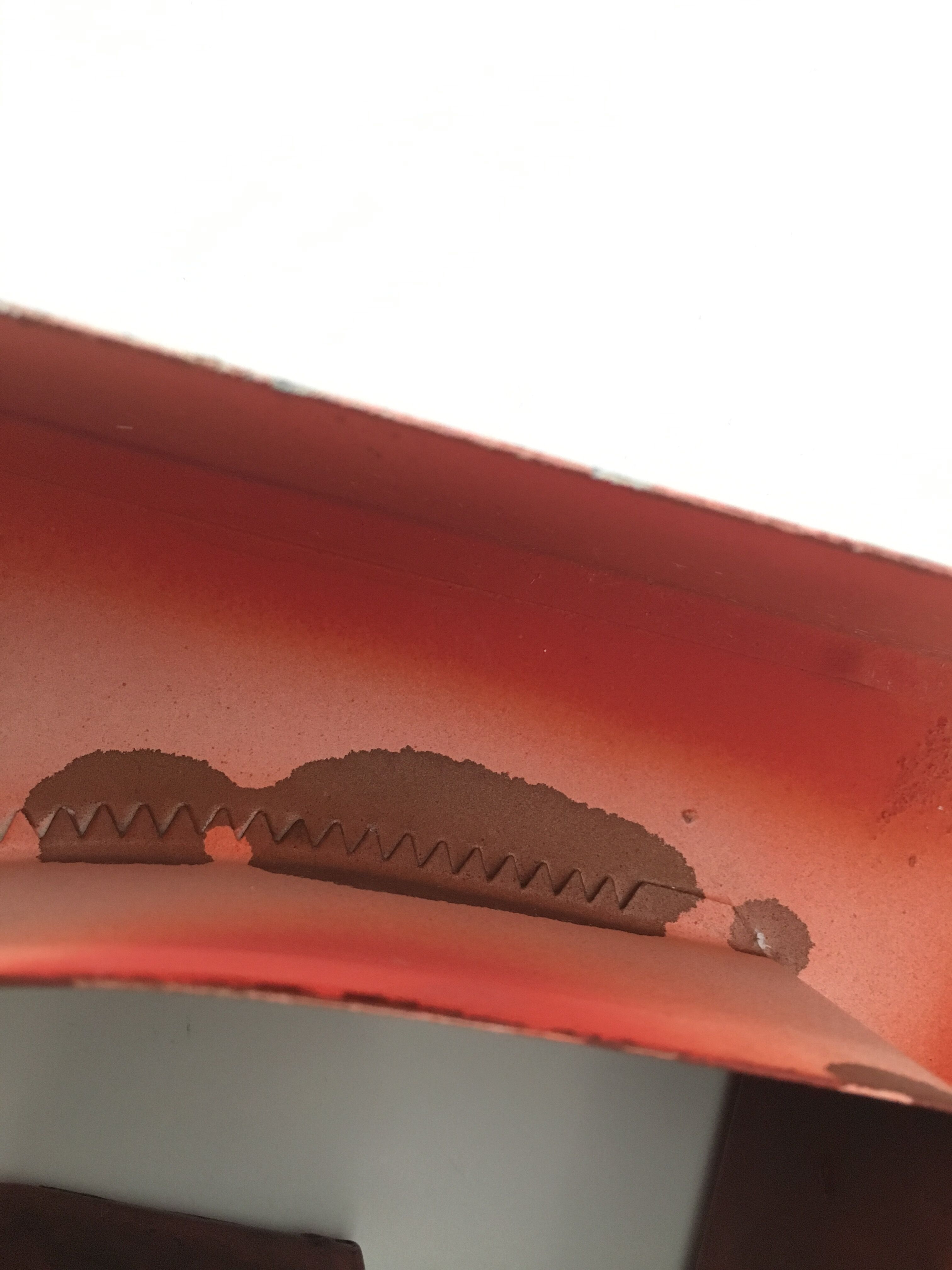 Red metal "F" sign letter