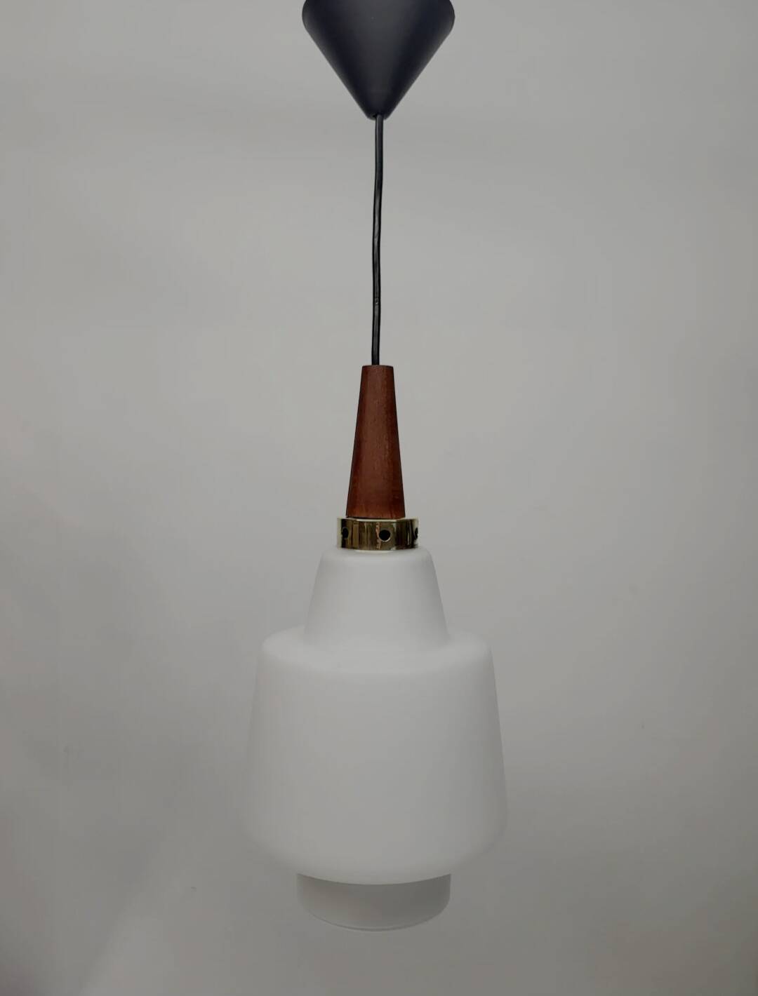 Scandinavian pendant light in opaline and teak, around 1960.
