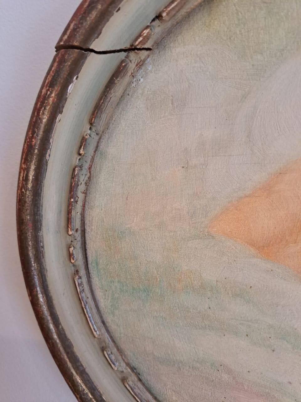 Ancient oval painting of a sleeping woman in oil on wood panel.