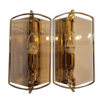 Pair of sconces in brass and smoked glass