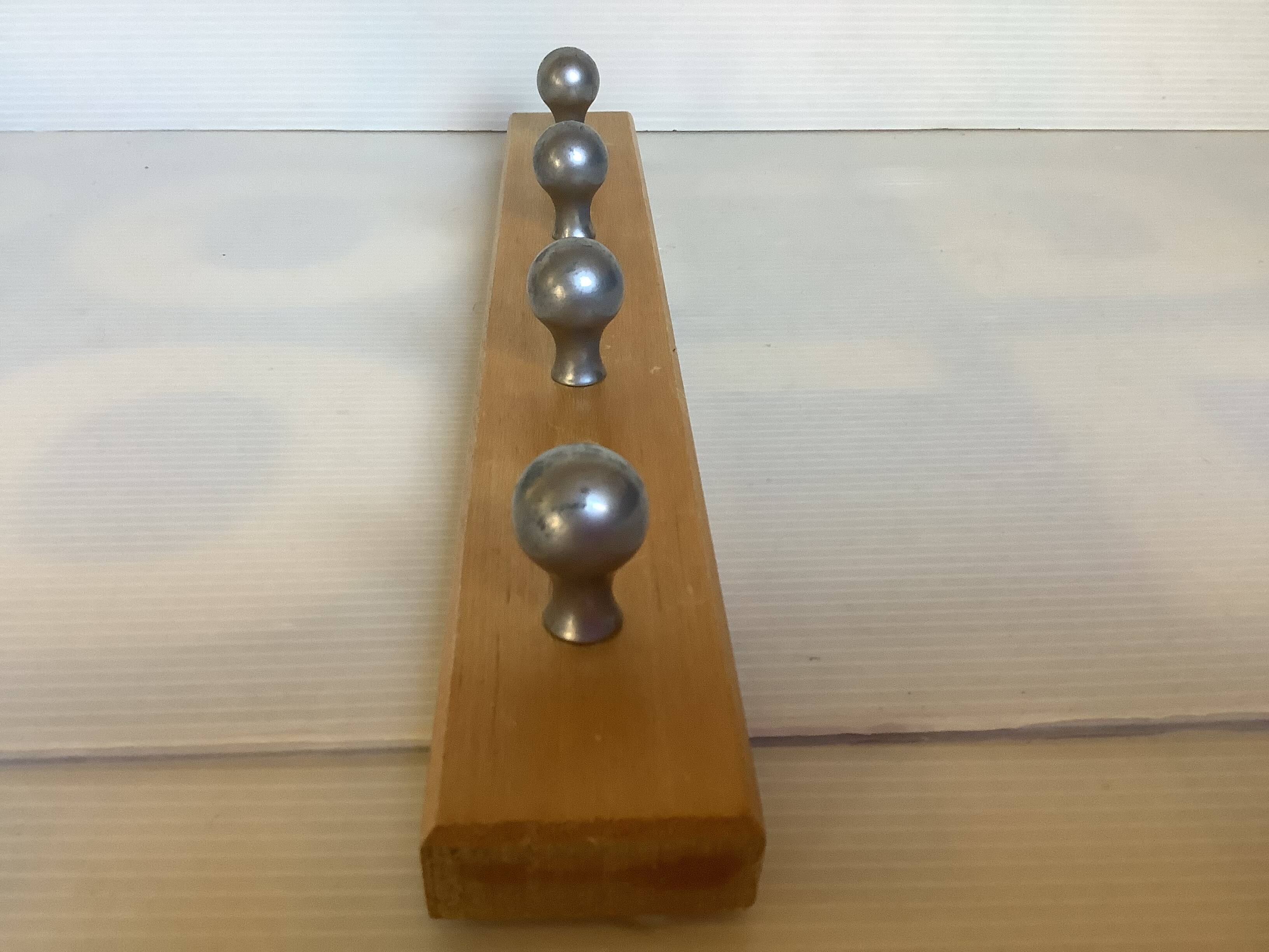 Wooden metal ball tea towel holder