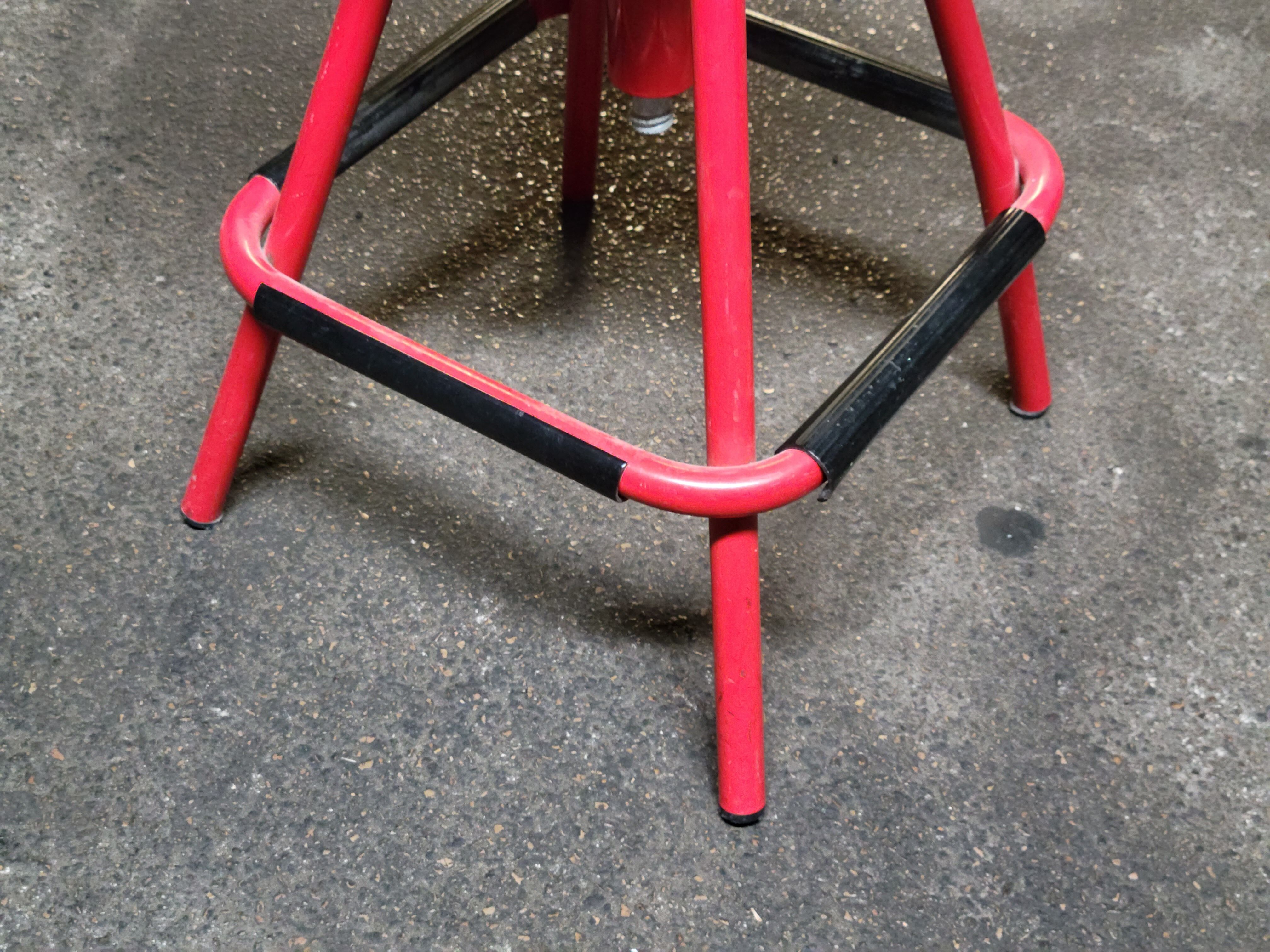 Red stool with industrial vintage screw 80s