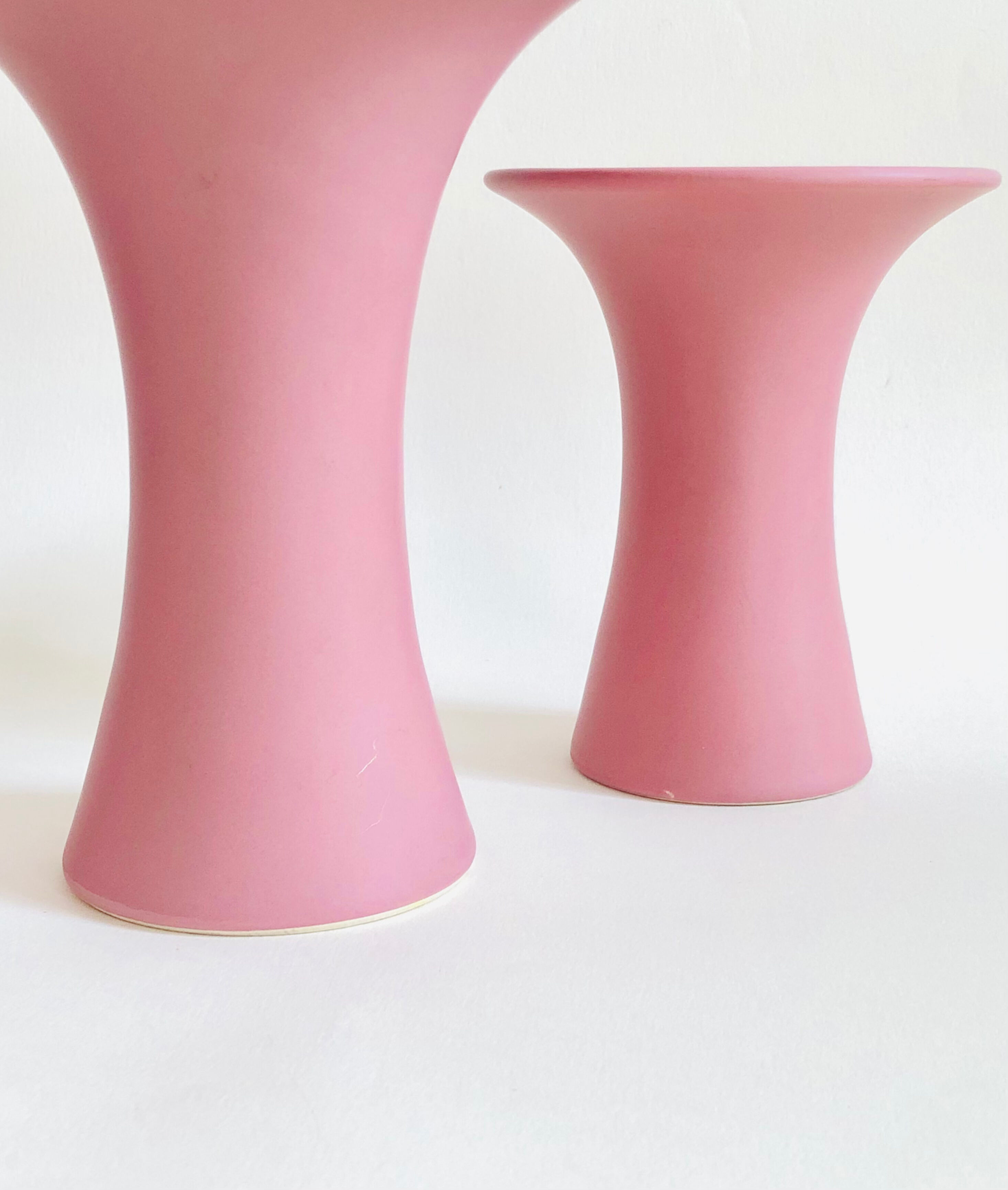 Set of three matte pink ceramic vases