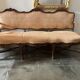 Louis XV style canapé from the late 19th century with a stretcher.