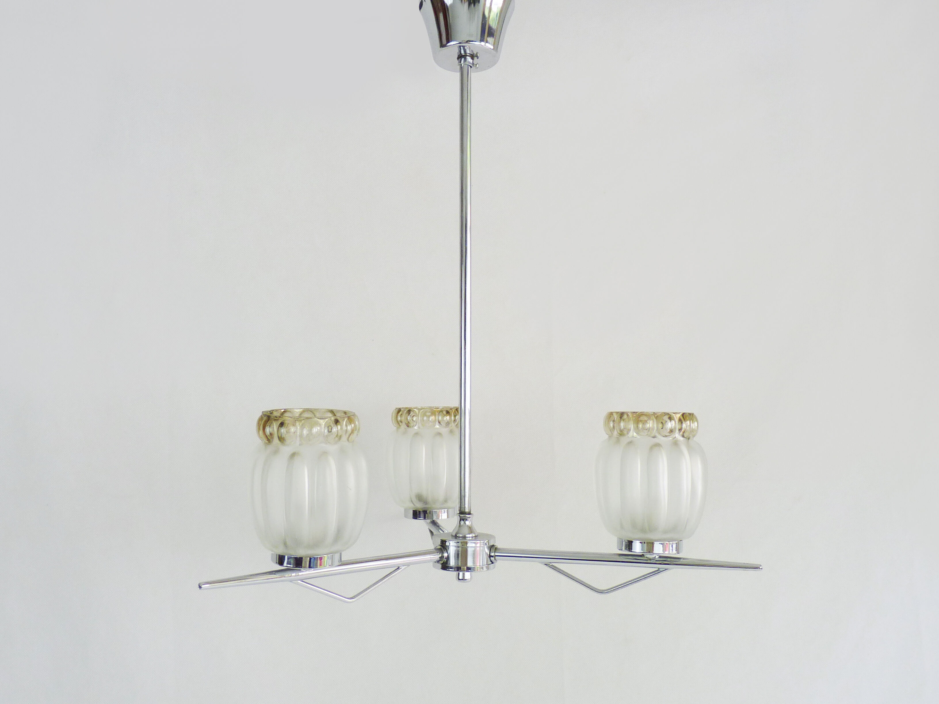 Vintage chandelier with 3 branches in chrome metal and glass globe. Year 70