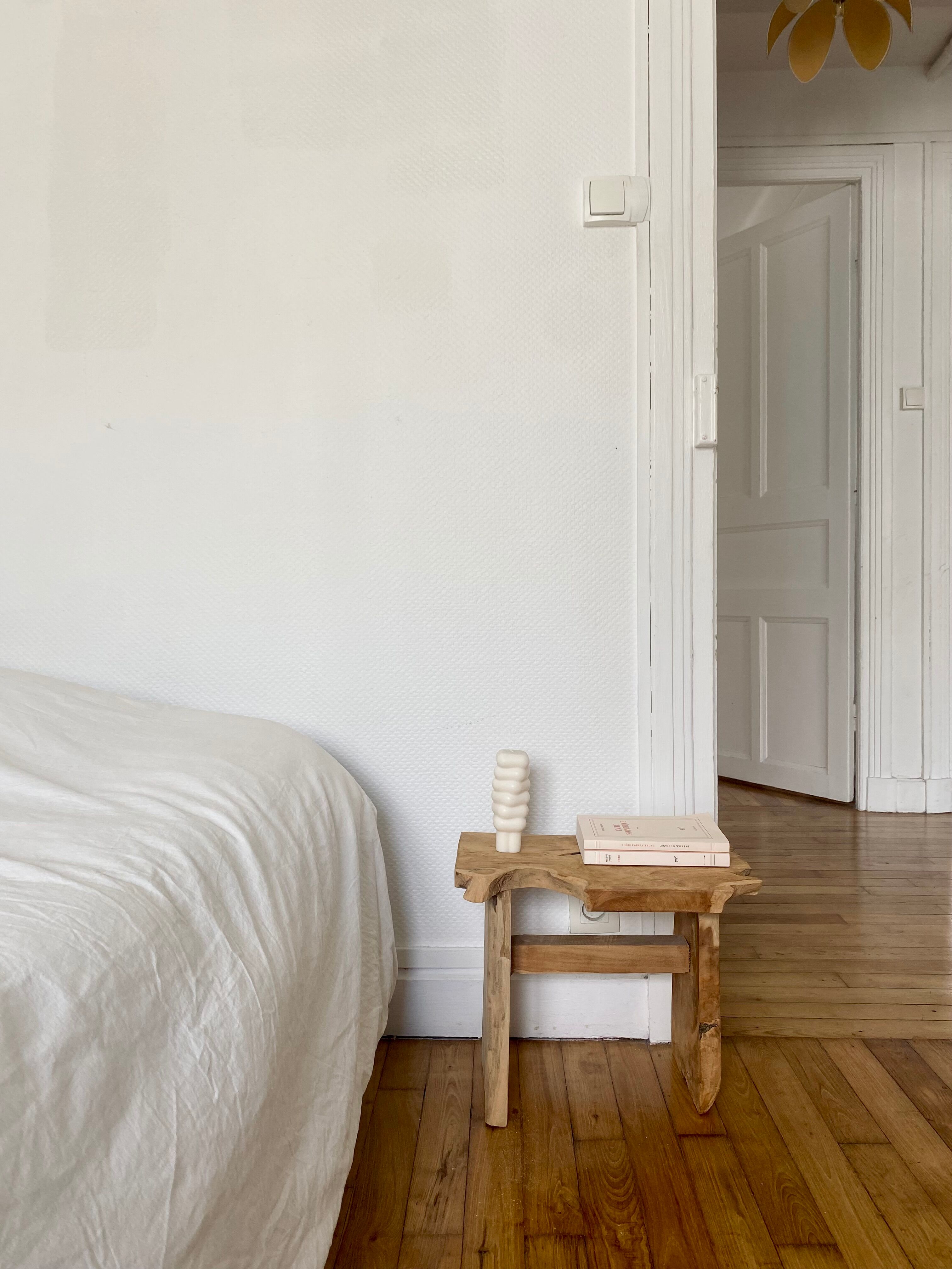 Low stool in raw wood