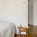 Low stool in raw wood