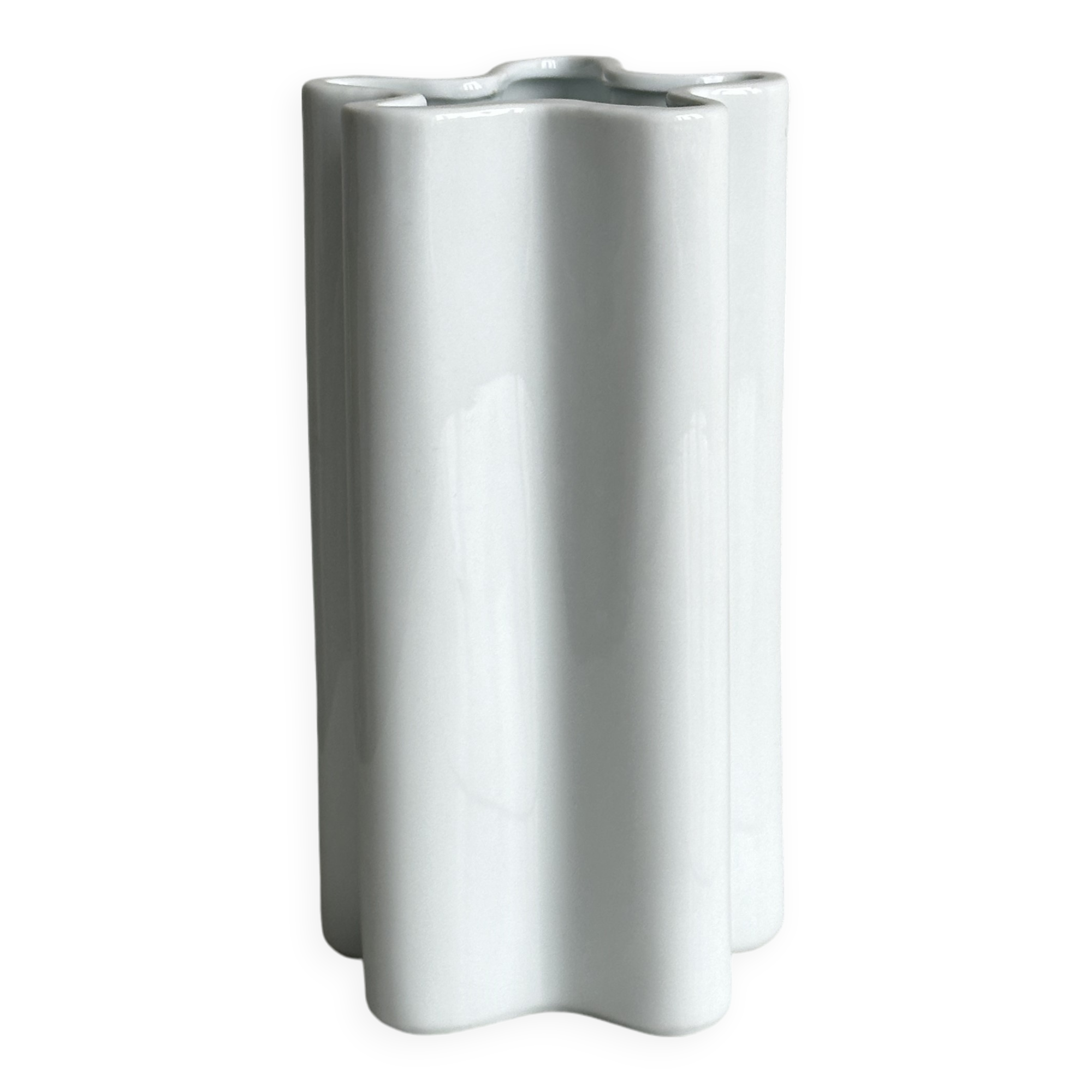 Modern white ceramic vase with wavy curves
