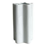 Modern white ceramic vase with wavy curves