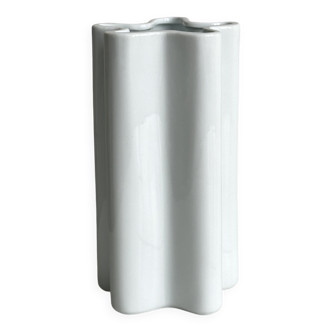 Modern white ceramic vase with wavy curves