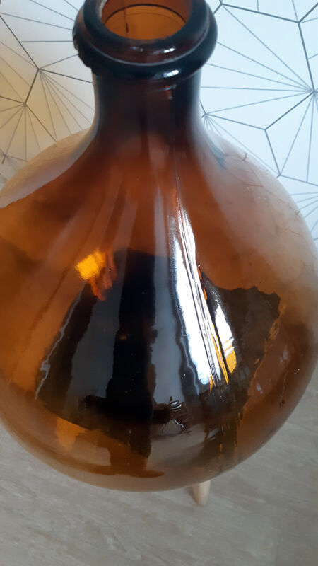 Great old demijohn in amber glass