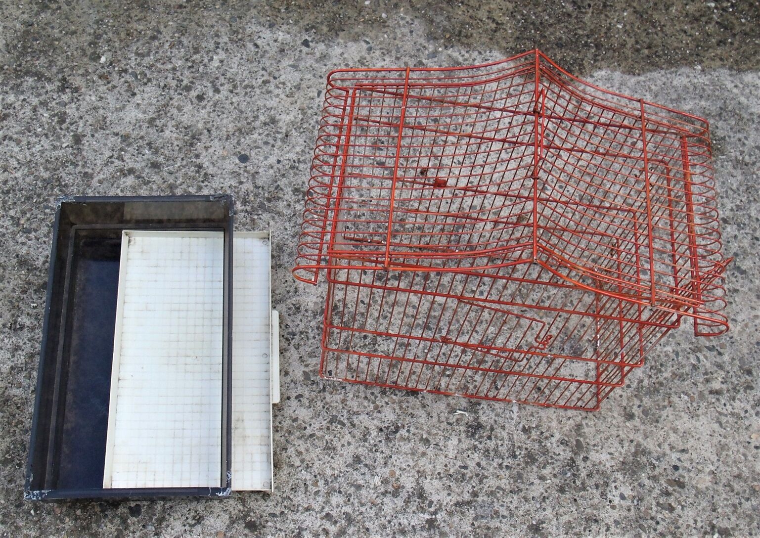 Old red metal birdcage