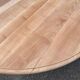 Round dining table with a central pedestal, extendable, stripped in solid walnut with 2 extensions.