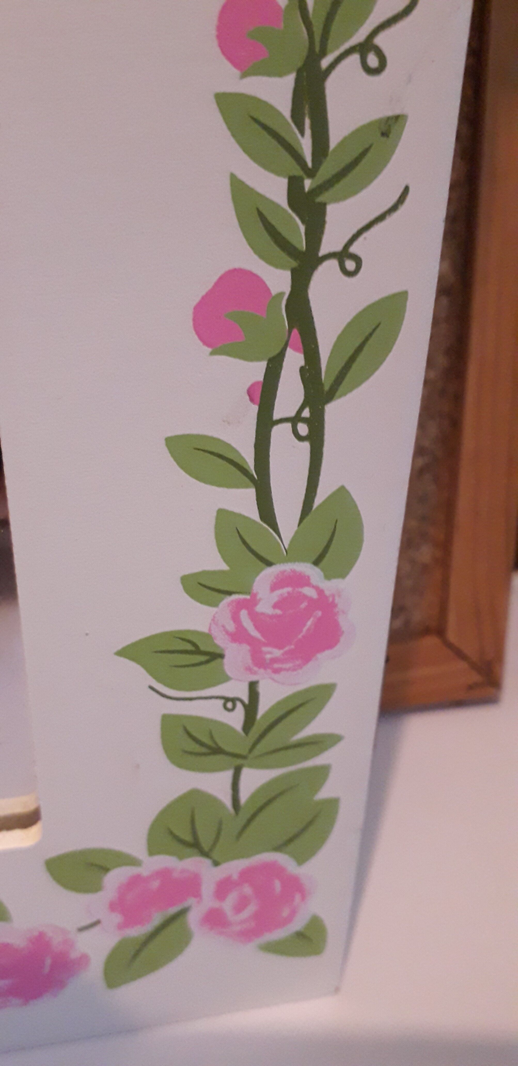 White mirrored toilet cabinet with floral pattern