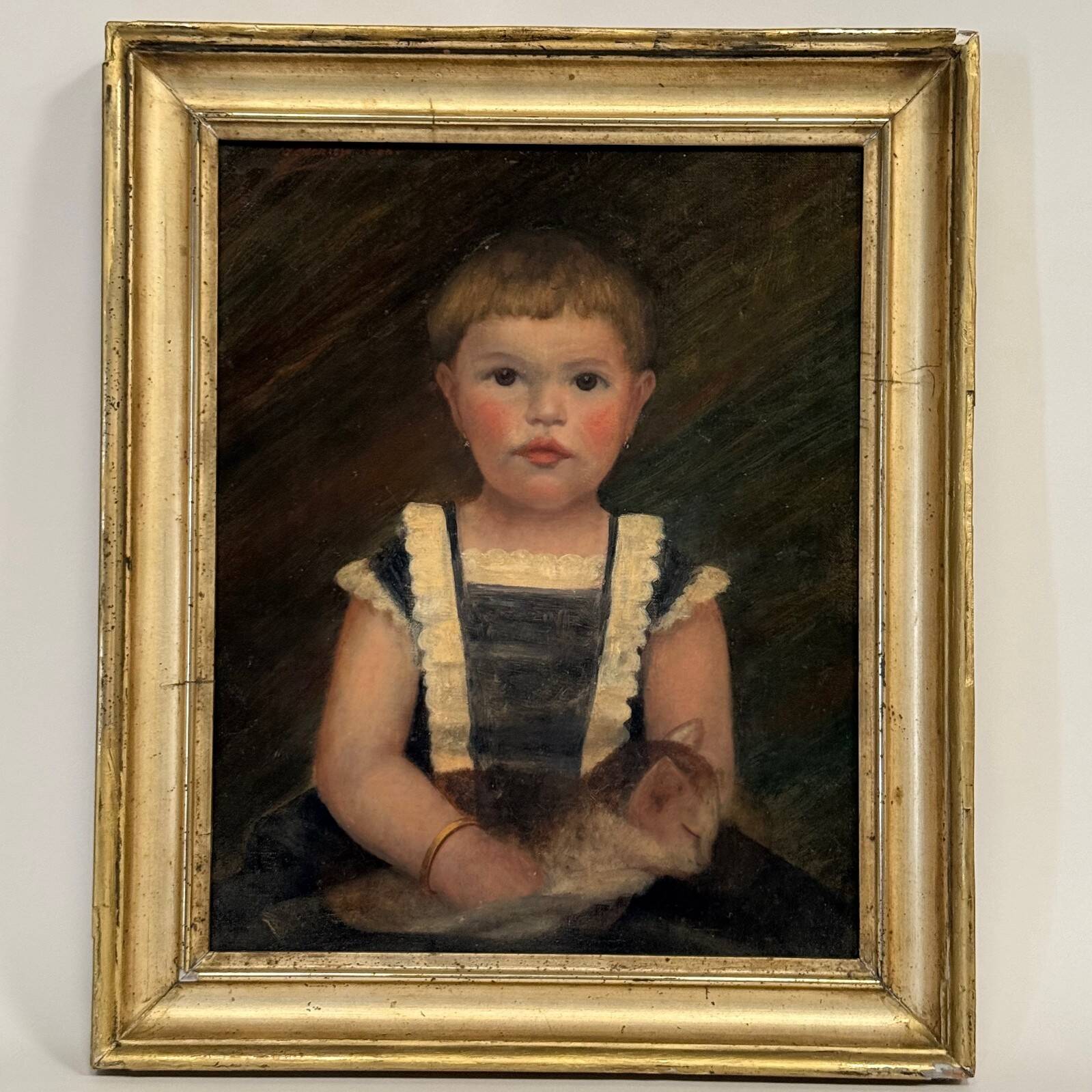 Oil on canvas 19th century young child carrying his cat gilded frame