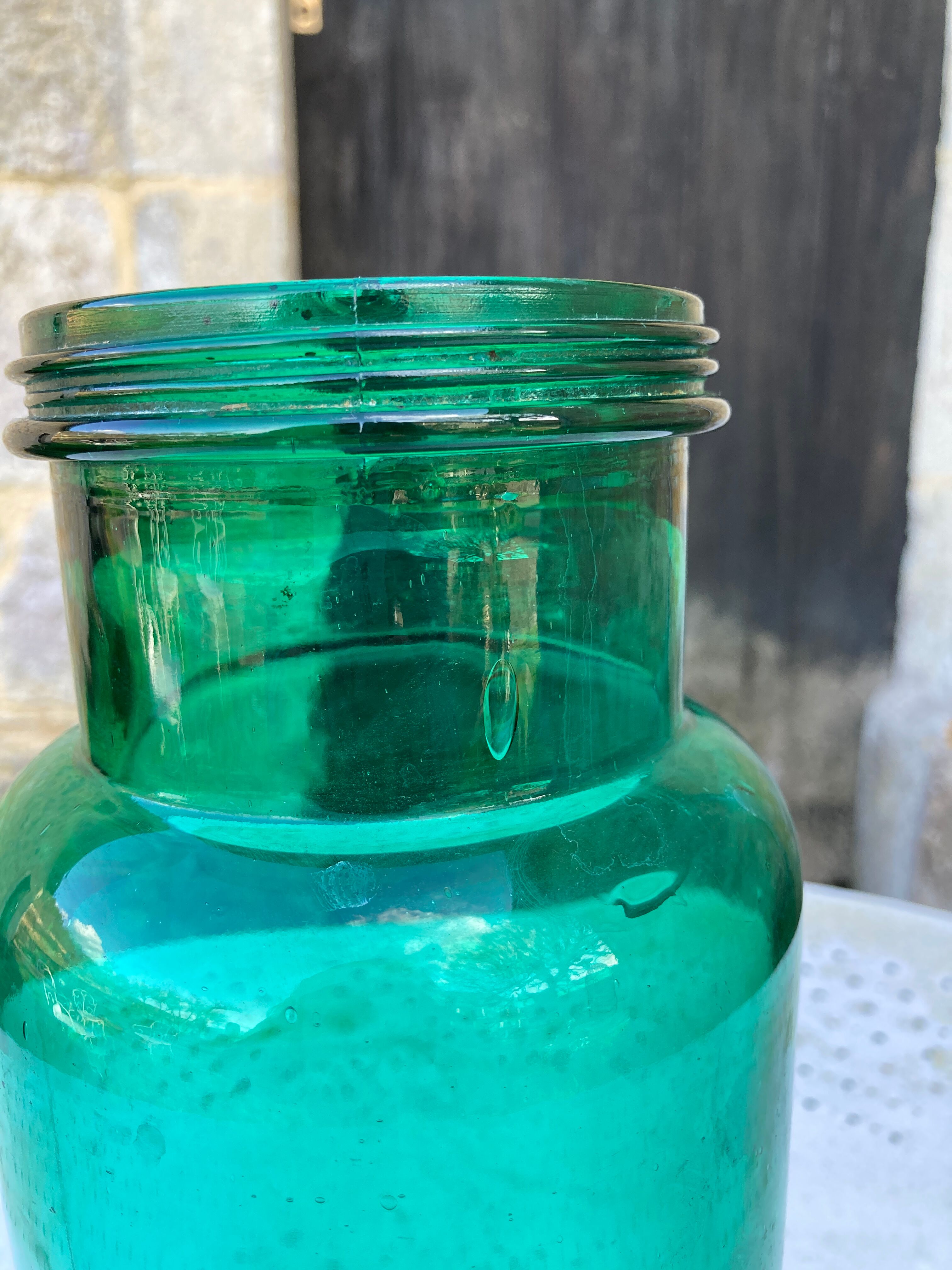 Large green glass jar