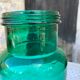 Large green glass jar