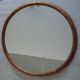 Old gilded wood oval mirror