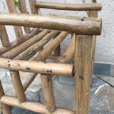 Art-Populaire armchair in raw wood, circa 1950.