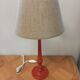 Red patinated wooden lamp