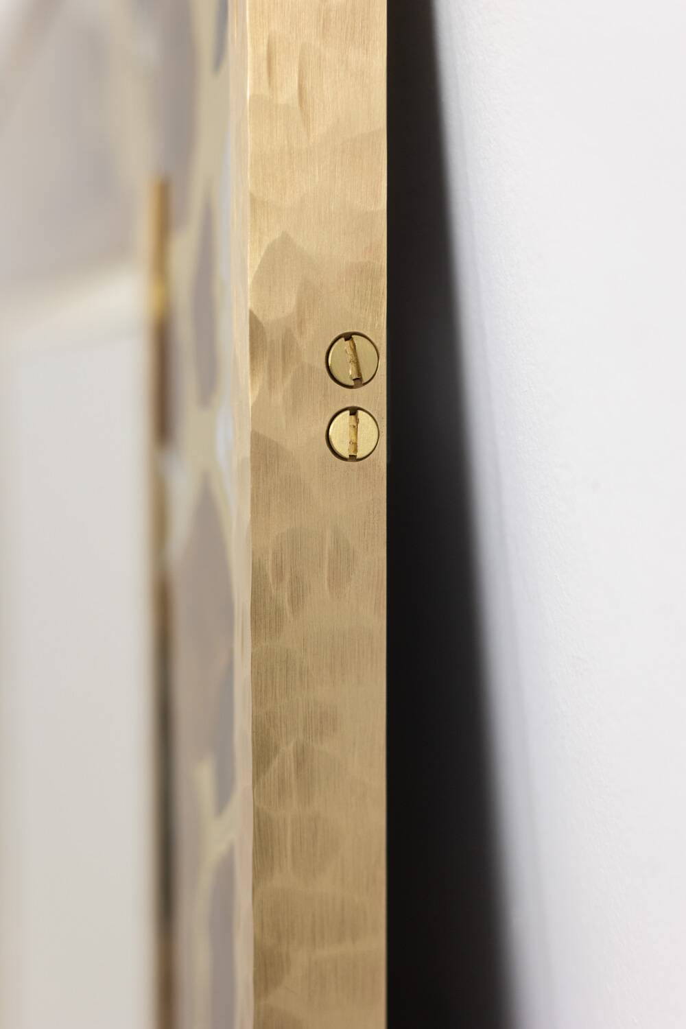 Mirror in marquetry of oxidised and patinated brass. Artist's work.