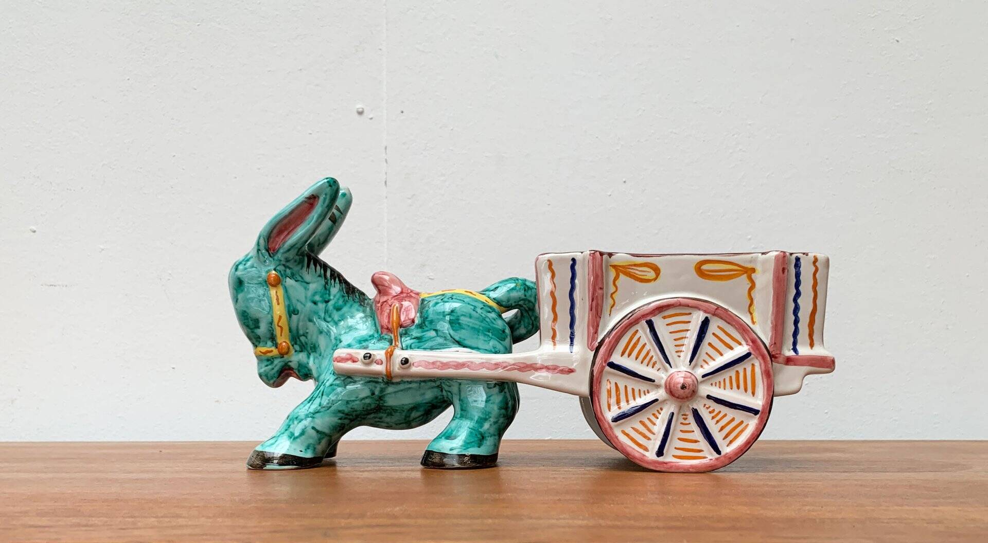 Vintage Italian hand-painted sculpture of a donkey with a cart in the shape of a bowl from Deruta, Italy.