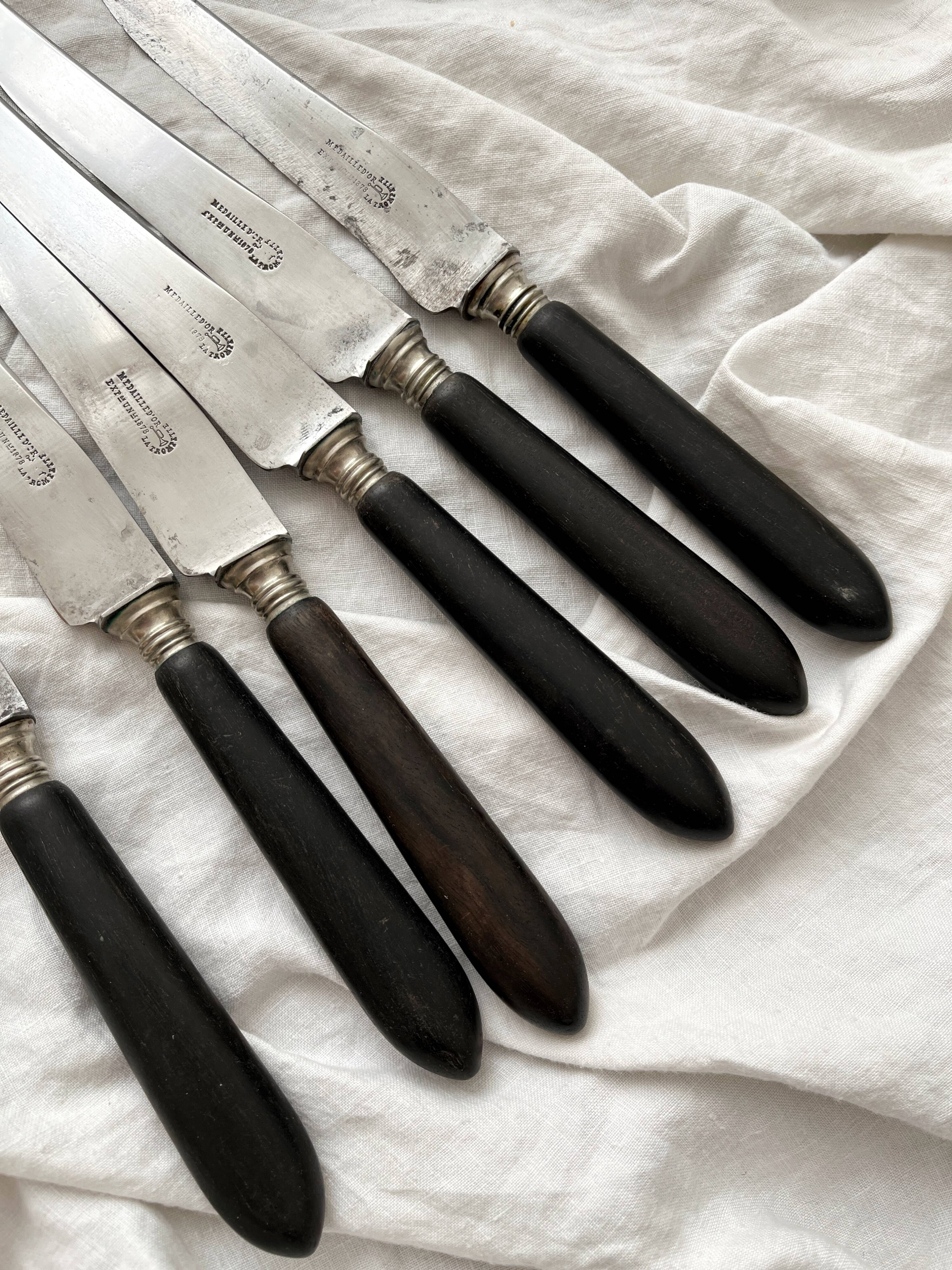 6 antique black wooden table knives La Trompette, late 19th century