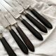 6 antique black wooden table knives La Trompette, late 19th century